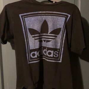 Women’s size small adidas black with blue writing t-shirt.